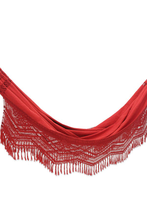 Red hammock with lavish fringed crocheted lace