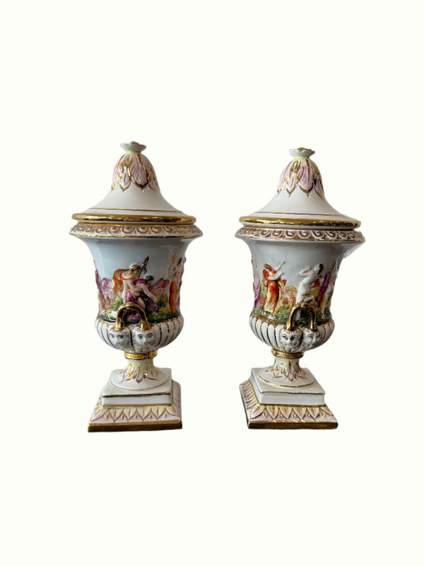 Two decorative urns with floral designs 