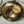 Vintage brass candleholder with a label 
