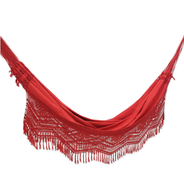 Red hammock with lavish fringed crocheted lace